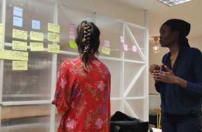 Living proof staff talking in front of planning board