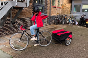 Spedal cyclist with delivery cart